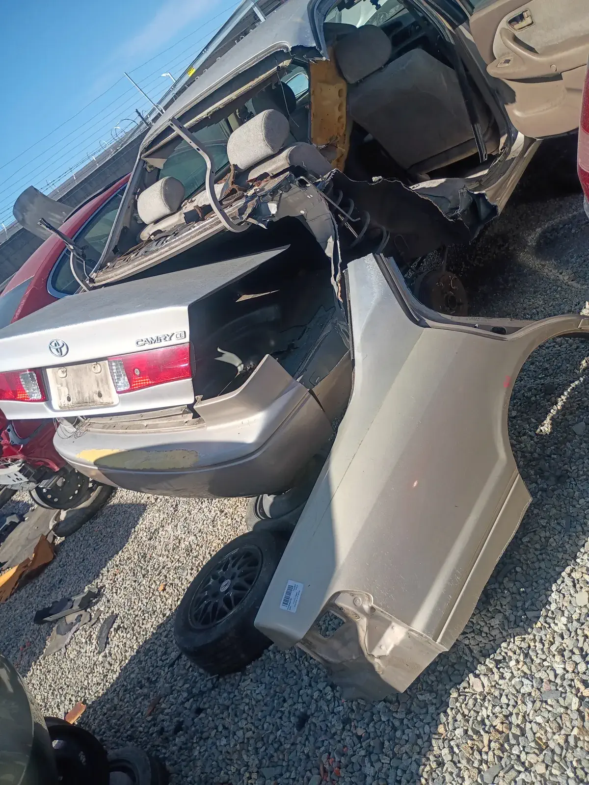 Brown Toyota Camry wrecked in the rear before auto body repair