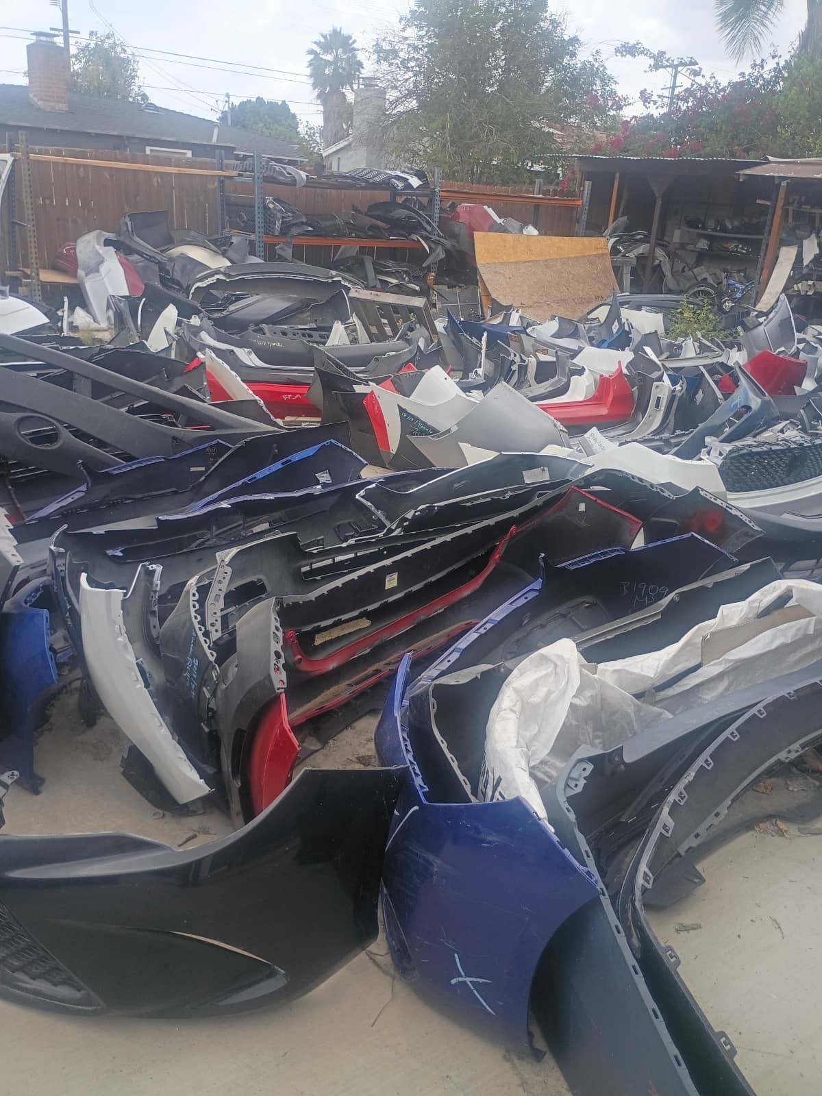 Car parts of various colors in the shop